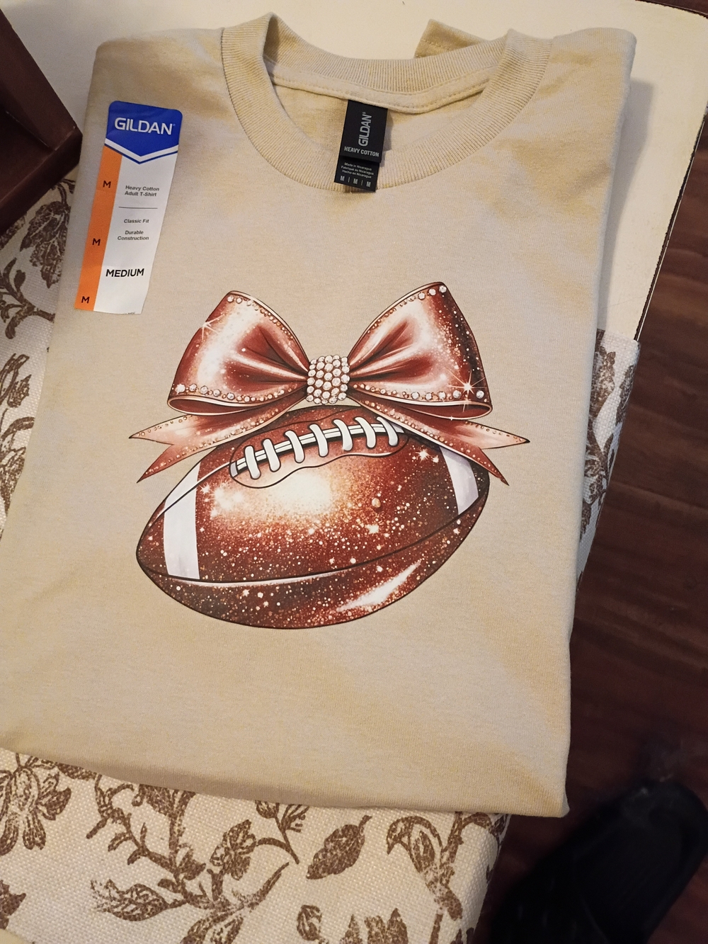 Gildan Women's Beige T-Shirt with Glitter Football and Bow Graphic